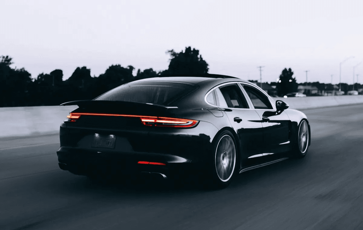 Black car driving on the road